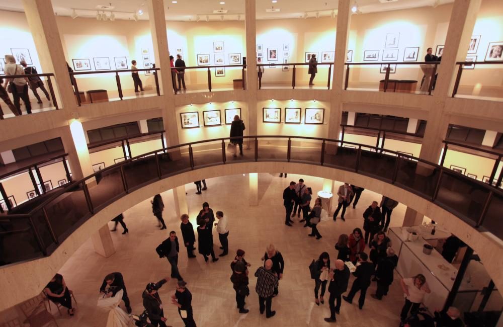 An art exhibition opening at the Joseph D. Carrier Art Gallery.
